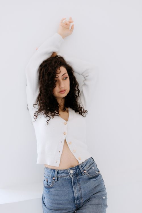 Woman in white cardigan, soft casual look