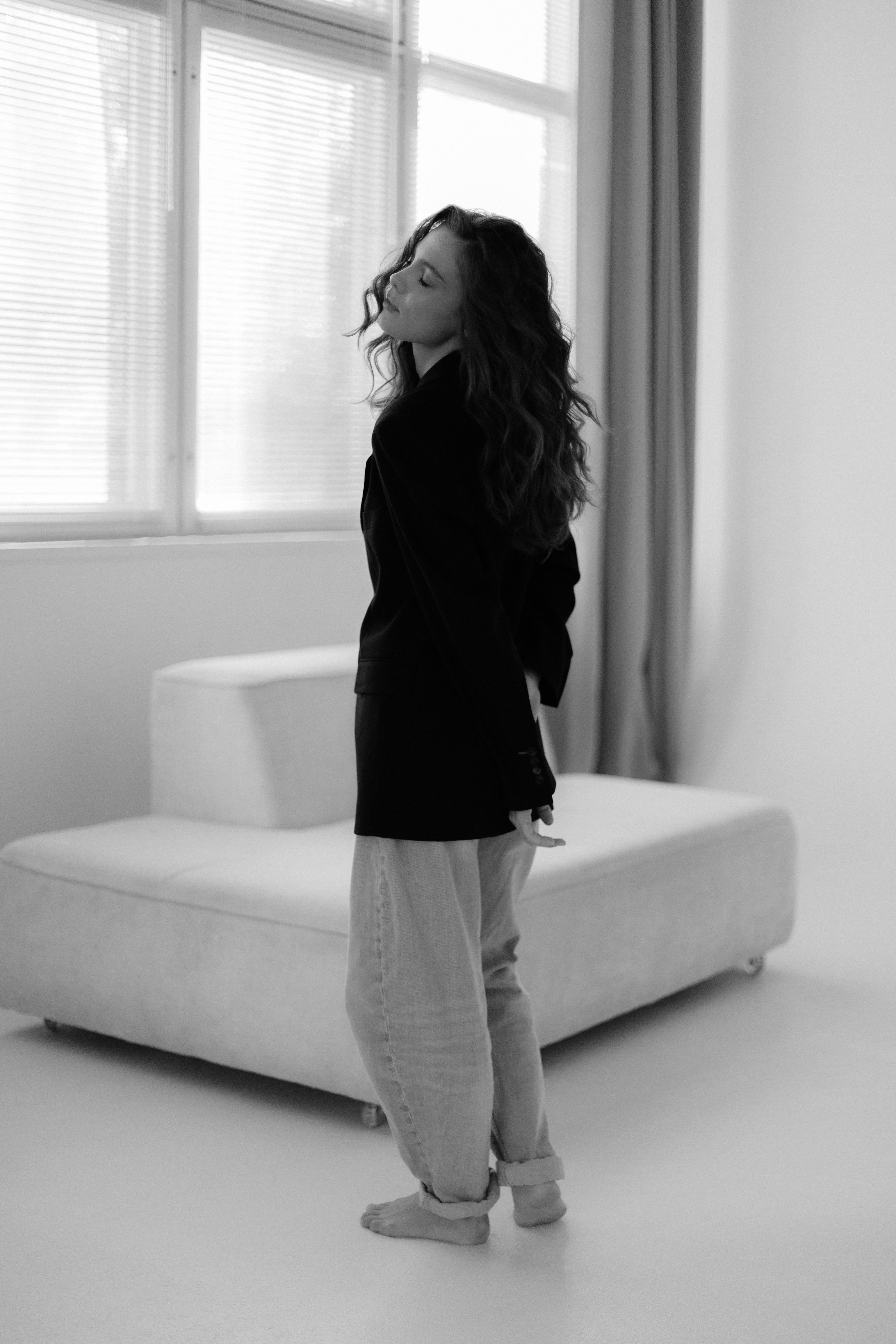 Artistic Portrait of a Woman in Minimalist Setting · Free Stock Photo