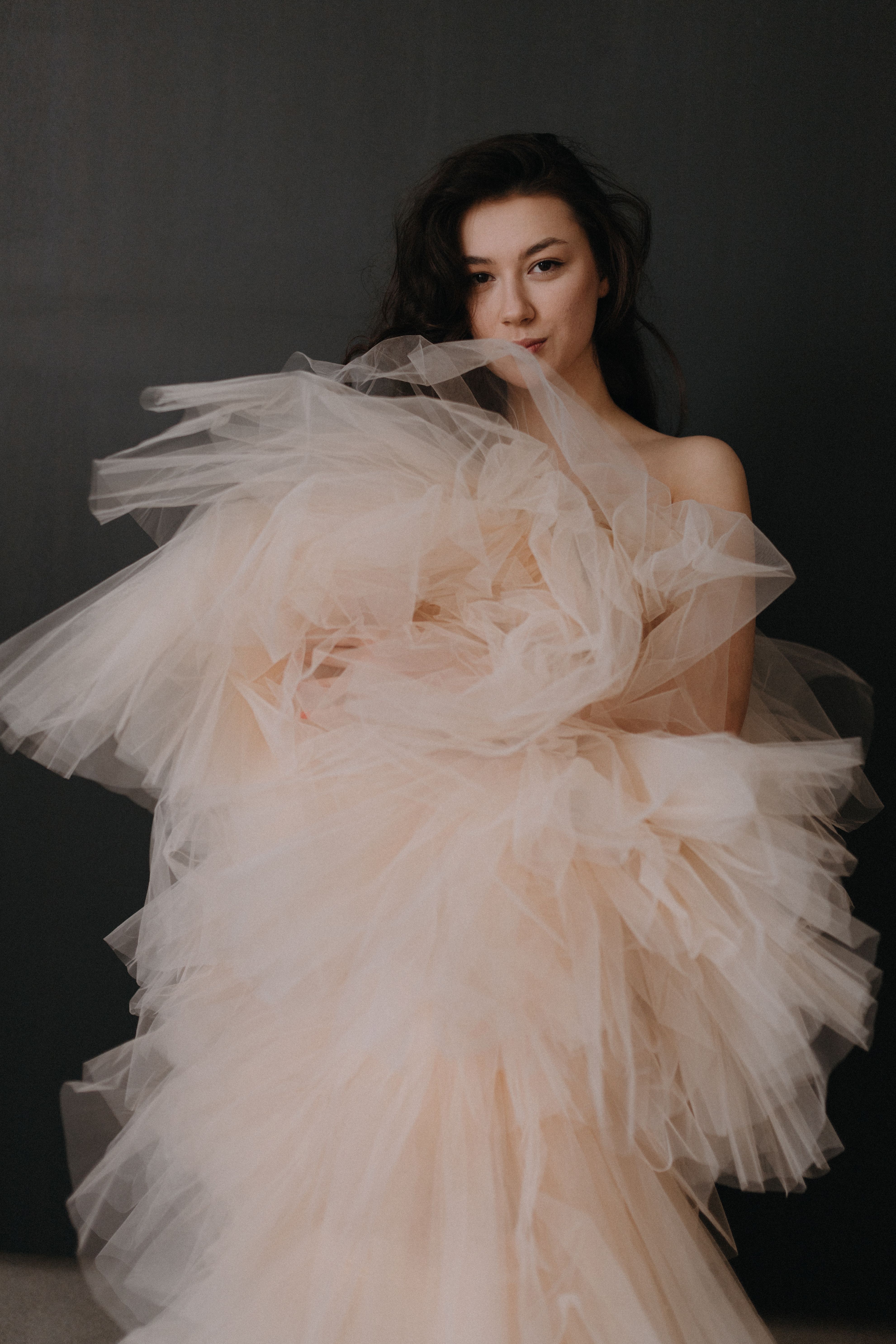Woman in a champagne tulle ballerina skirt with a fitted black top