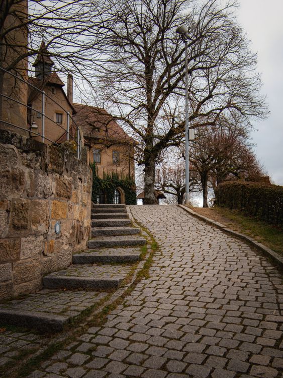 Charming European Cobblestone Street in Autumn · Free Stock Photo