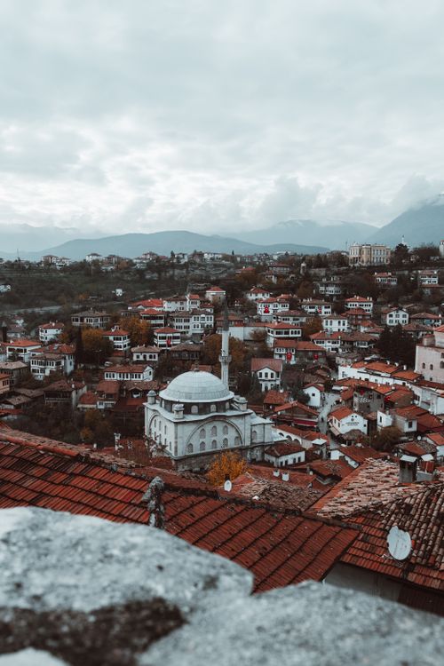 Free A picturesque view of Safranbolu, Turkey featuring traditional Ottoman architecture under a cloudy sky. Stock Photo