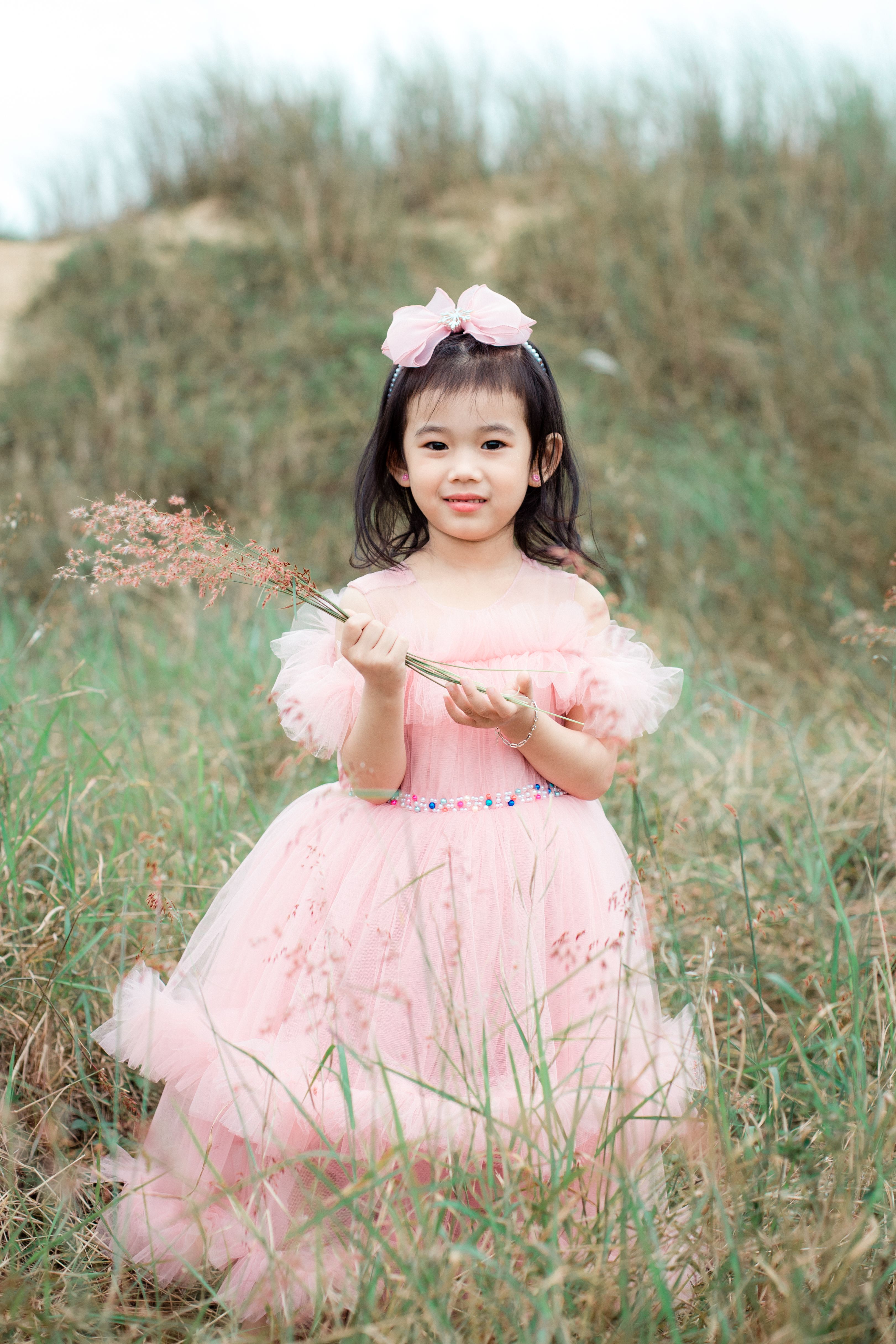 Charming Young Girl in Pink Dress Outdoors · Free Stock Photo