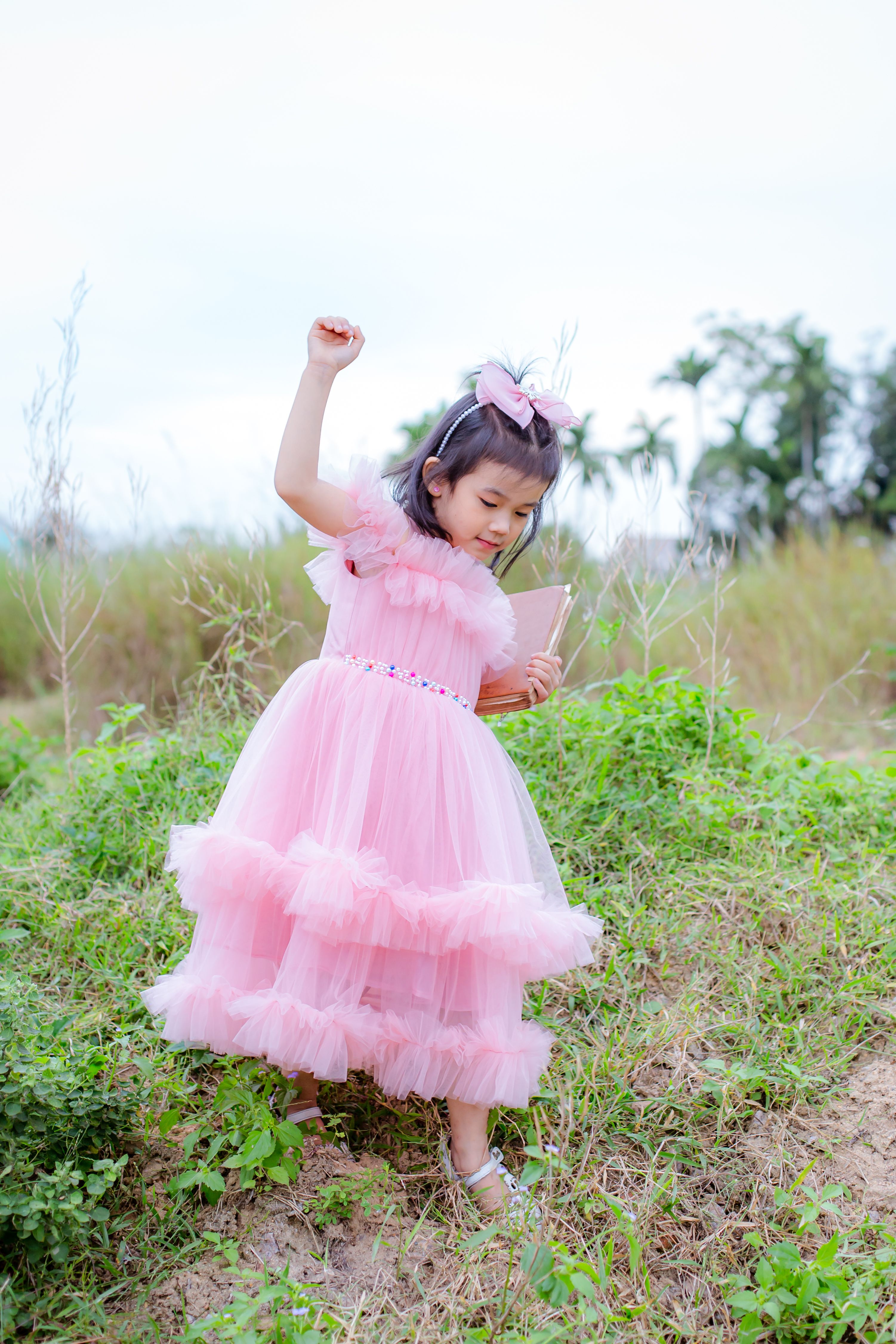 Little Girl in Pink Dress Outdoors in Hoi An · Free Stock Photo