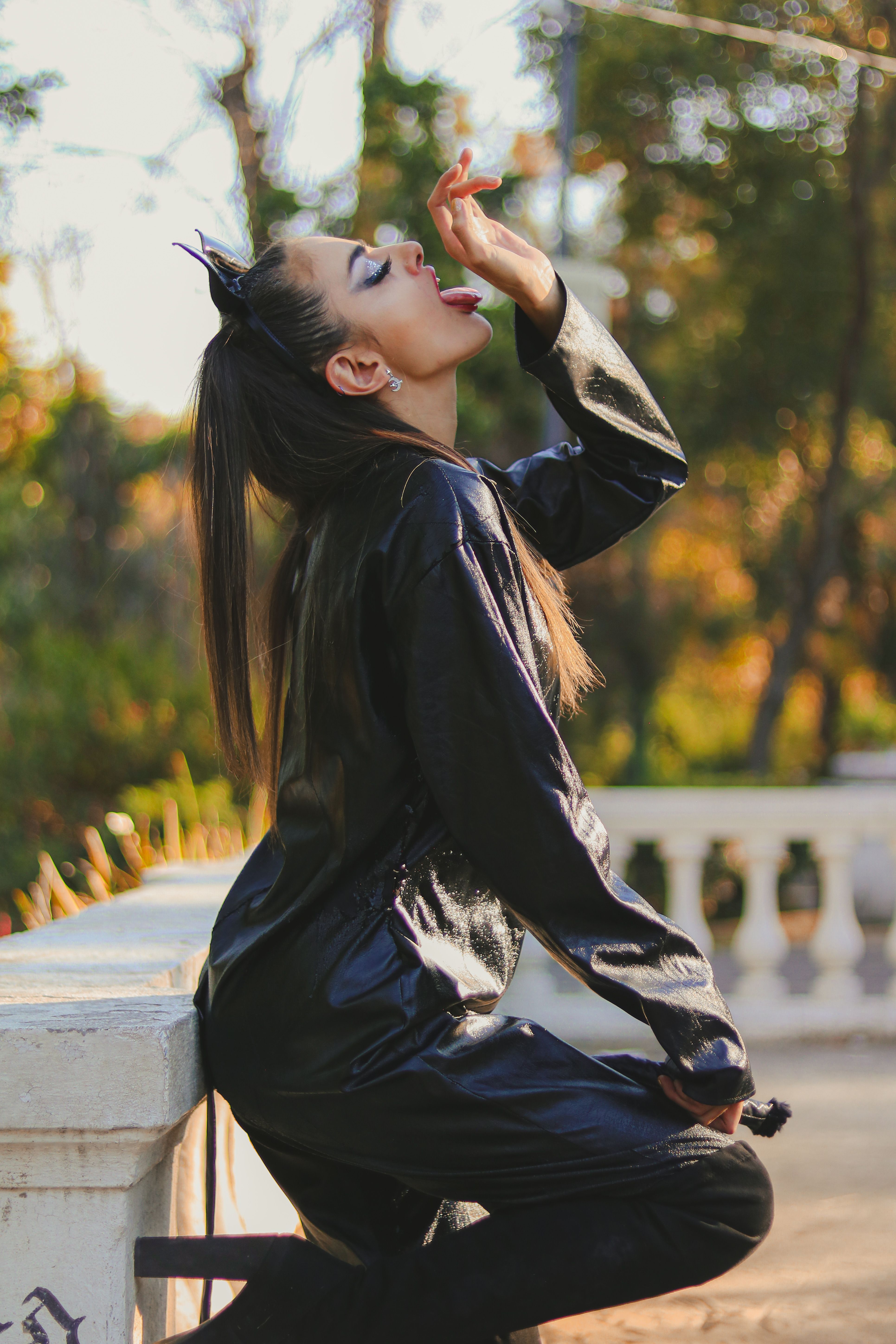 Stylish Woman in Black Outfit Posing Outdoors · Free Stock Photo
