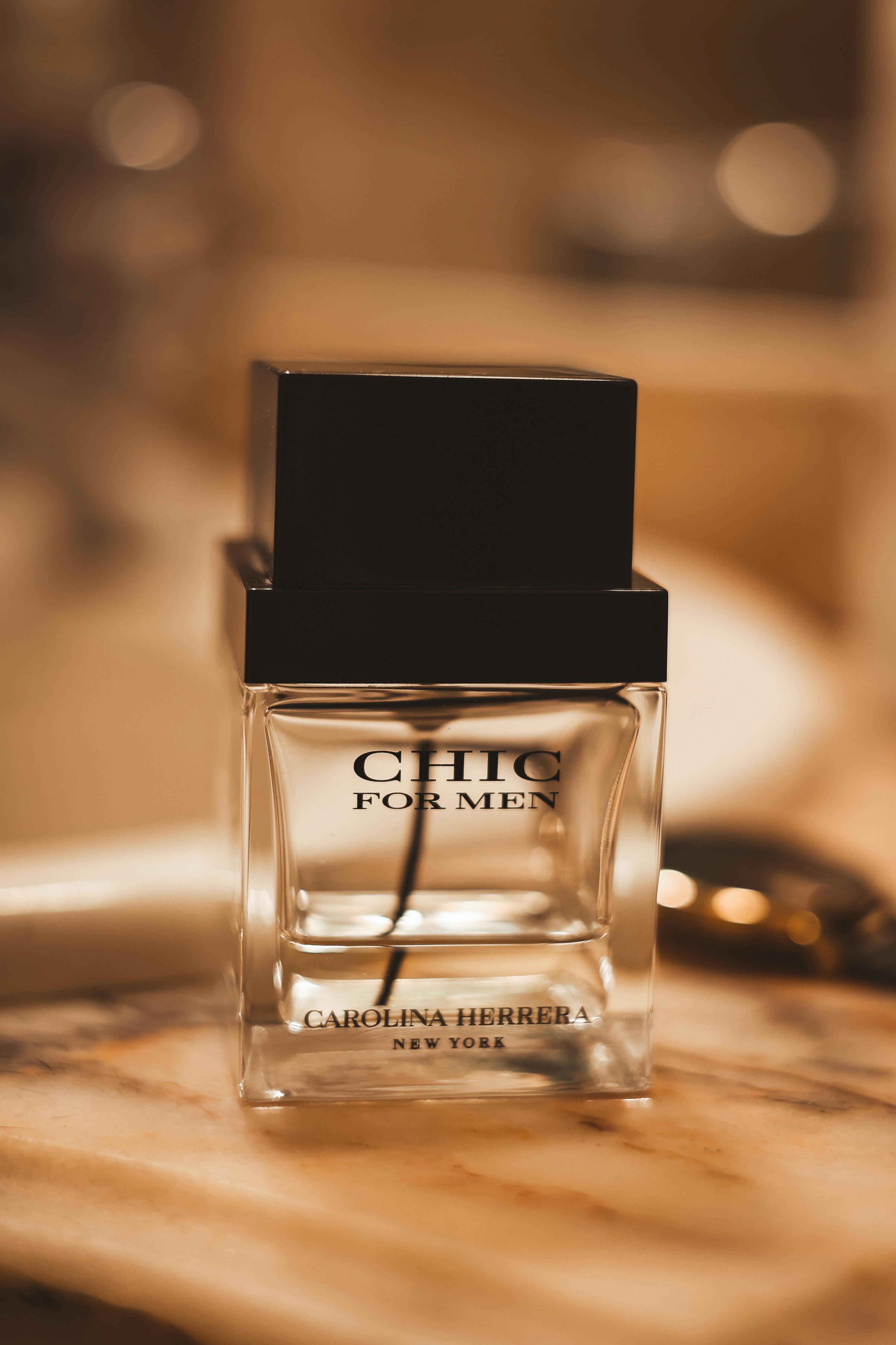 Stylish Chich for Men fragrance bottle on a luxurious marble background.