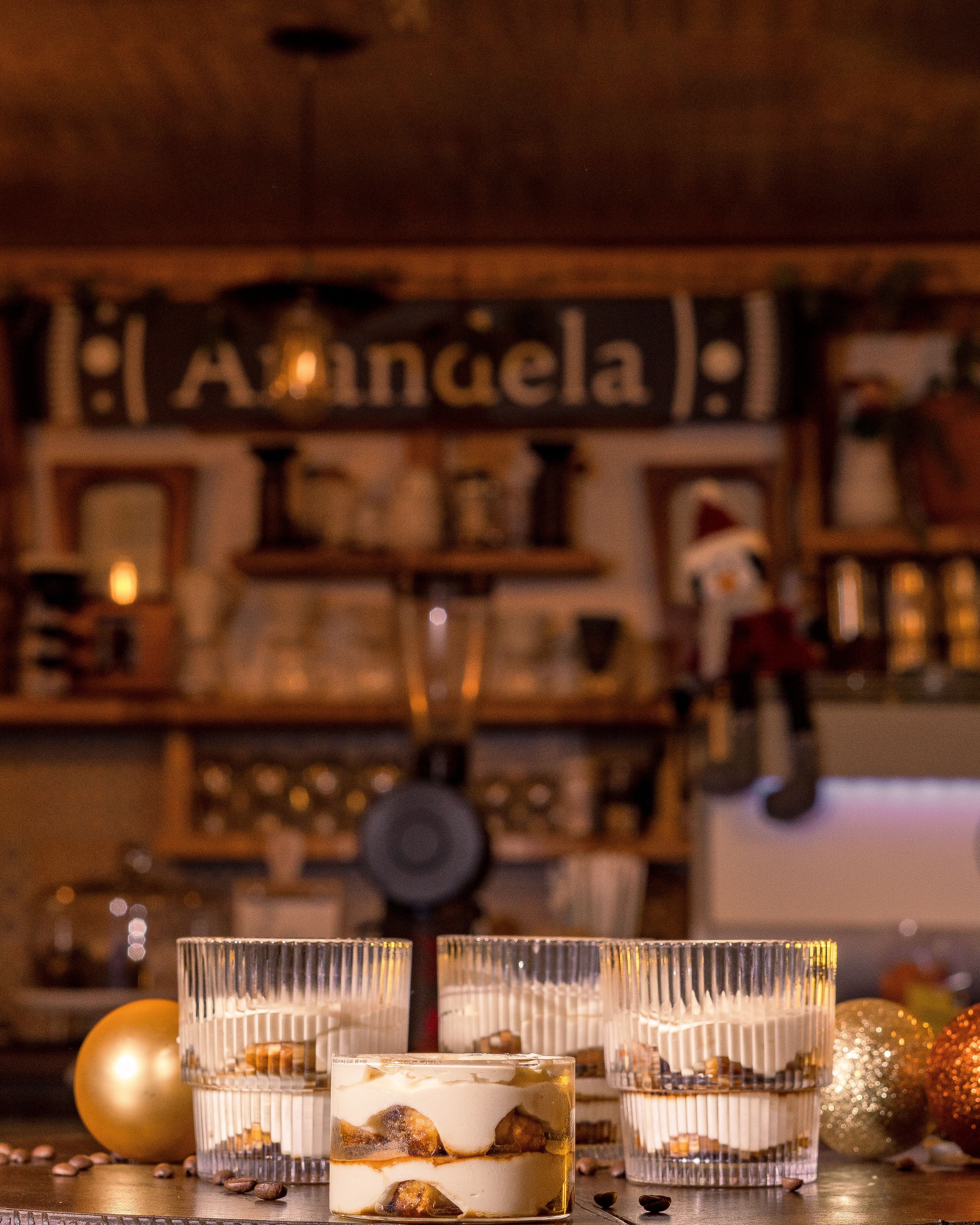 Tantalizing tiramisu served with Christmas decor in a cozy Santiago de Querétaro café.