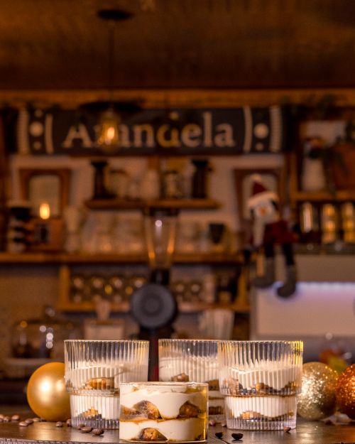 Free Tantalizing tiramisu served with Christmas decor in a cozy Santiago de Querétaro café. Stock Photo