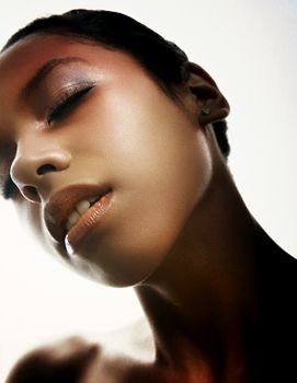 Close-up portrait highlighting serene beauty and soft lighting.