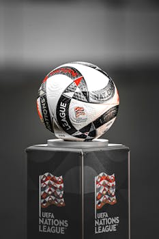 Close-up of the UEFA Nations League match ball on a podium, showcasing design details.