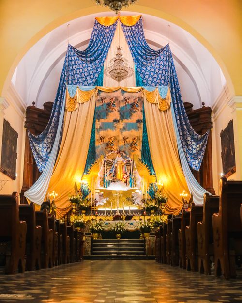 Free A beautifully decorated altar with vibrant drapery inside a historic church. Stock Photo