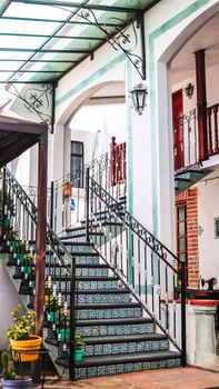 Beautiful courtyard featuring intricate tile work and wrought iron designs.
