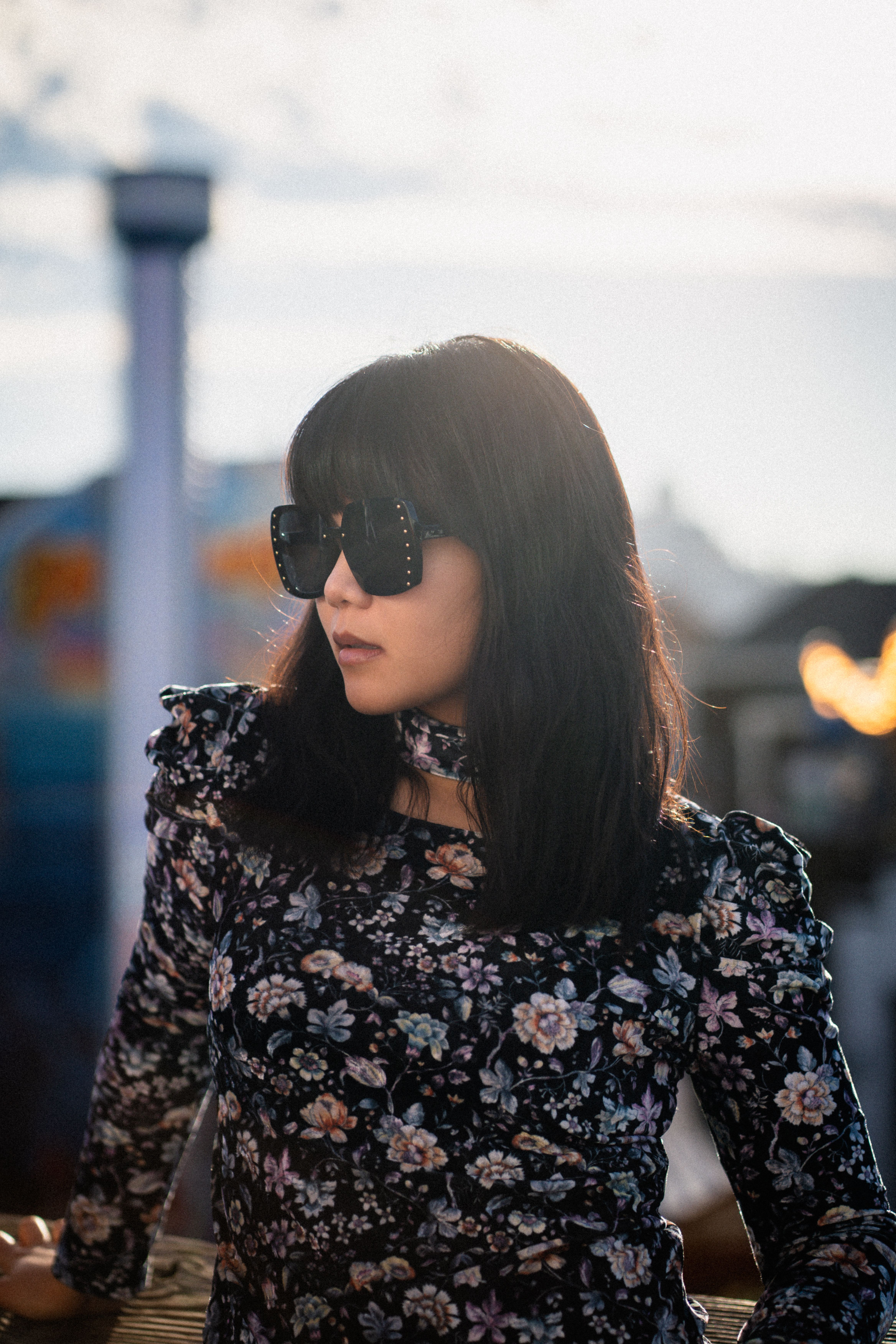 Stylish Woman Posing Outdoors in Sunglasses · Free Stock Photo
