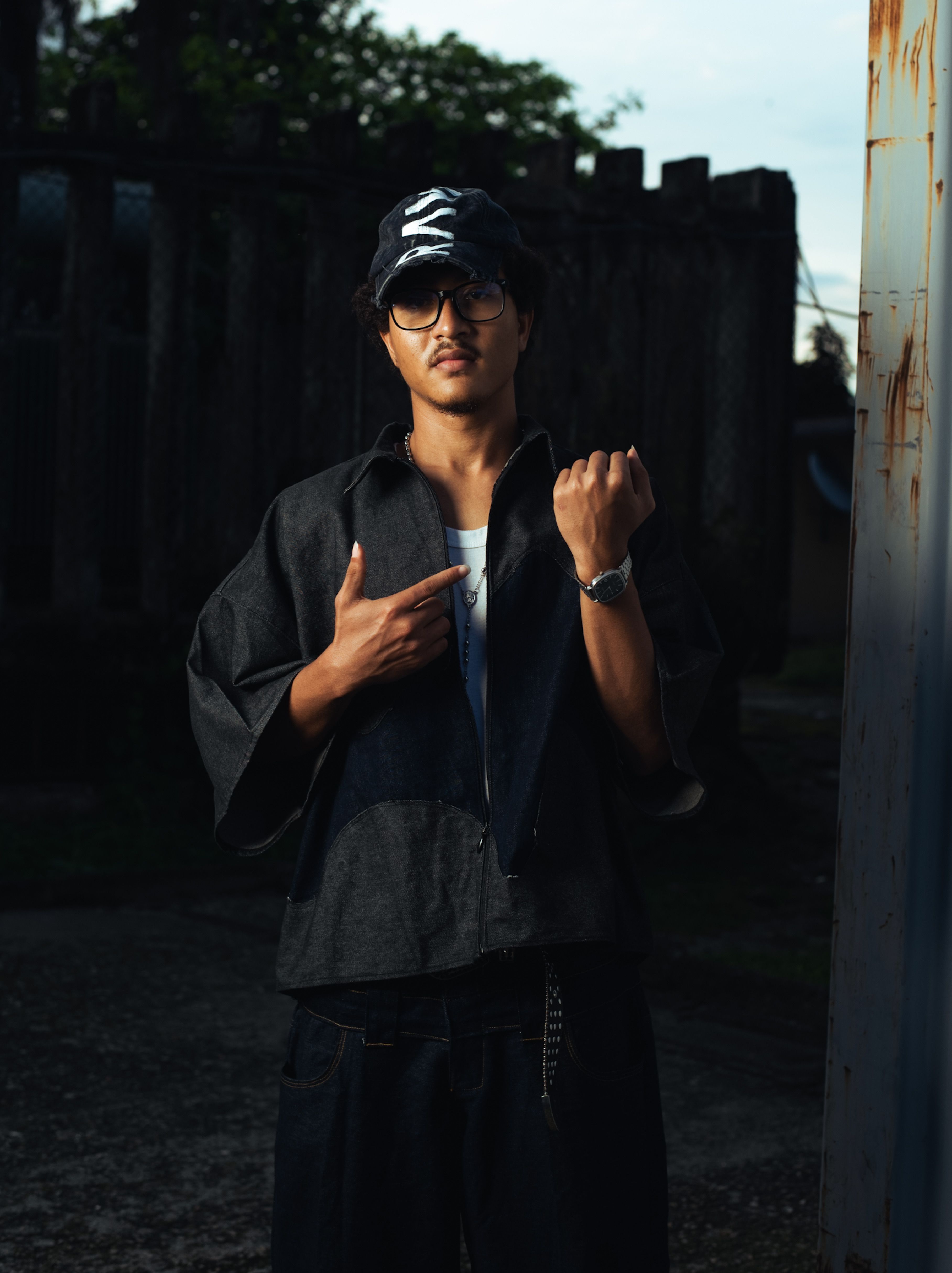 Portrait of a fashionable man outdoors in Port Harcourt, Nigeria. Urban and moody ambiance.