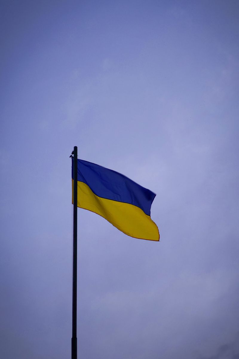 Ukrainian flag waving against a clear sky