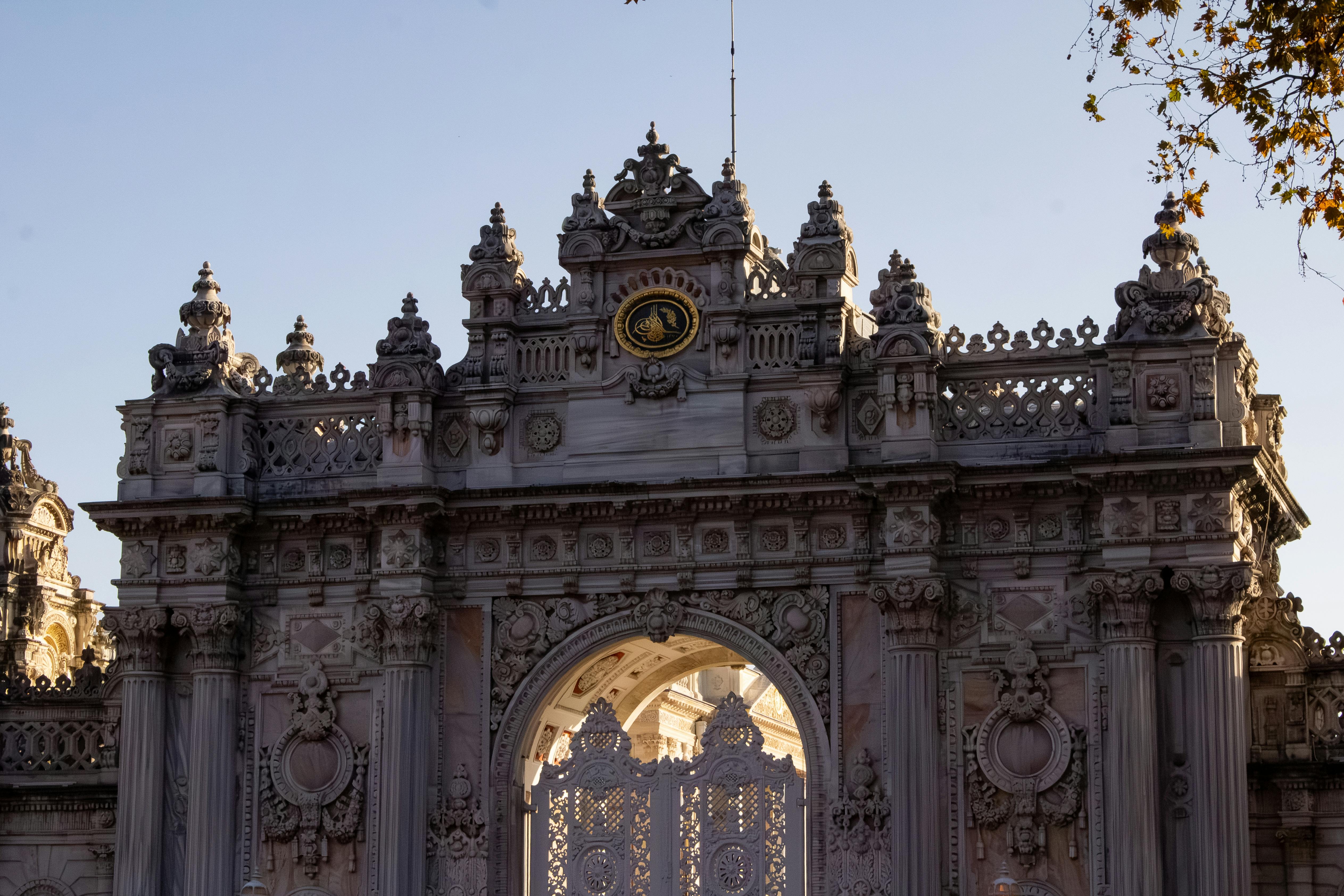 Ornate gate of Dolmabahçe Palace showcasing intricate Ottoman architecture.