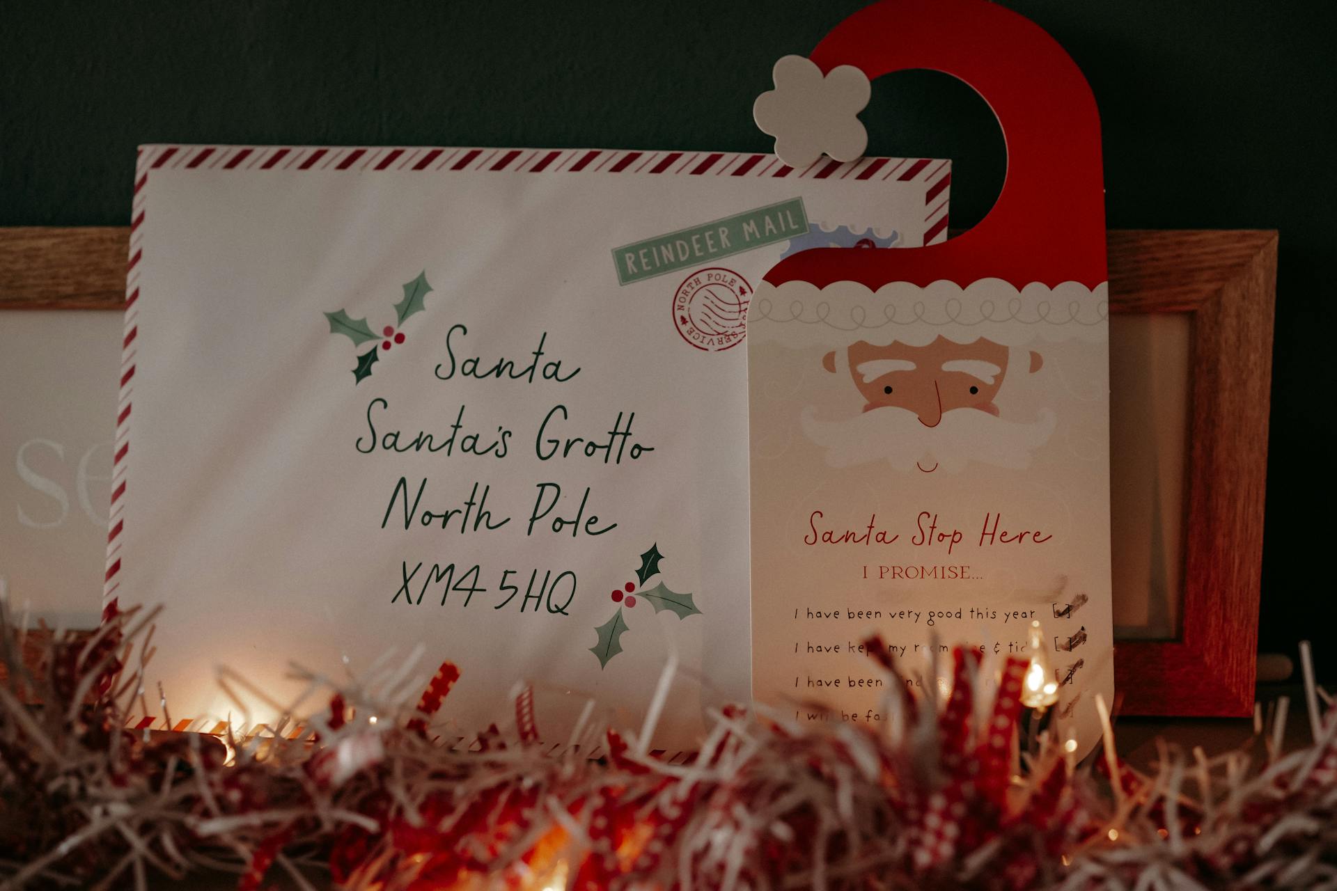A charming Christmas letter to Santa with festive decorations, fairy lights, and tinsel.