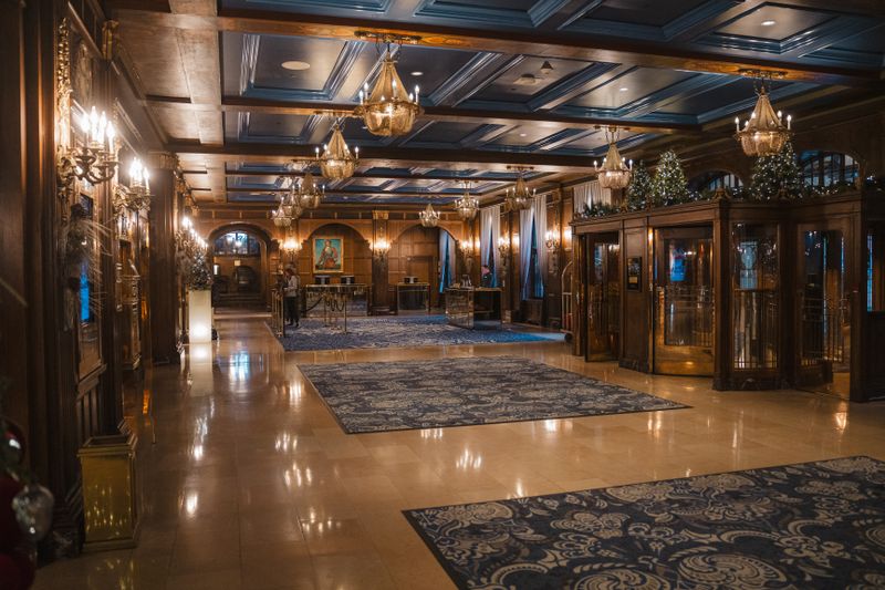 Elegant hotel lobby with chandeliers and blue accents