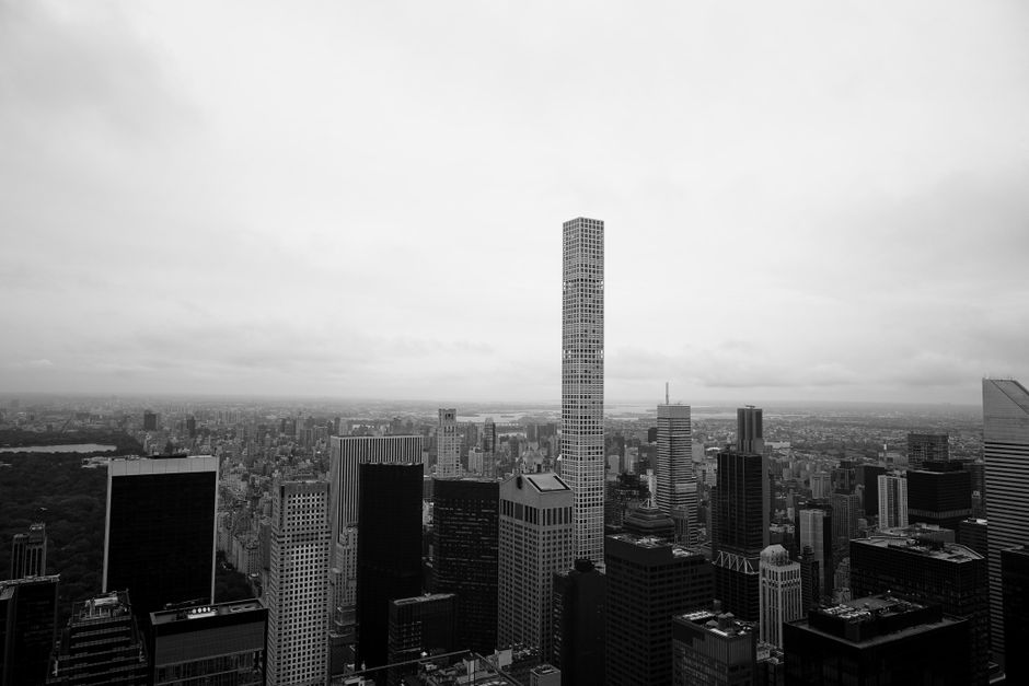 Black and white view of New York City's skyline featuring tall skyscrapers, and Central Park.