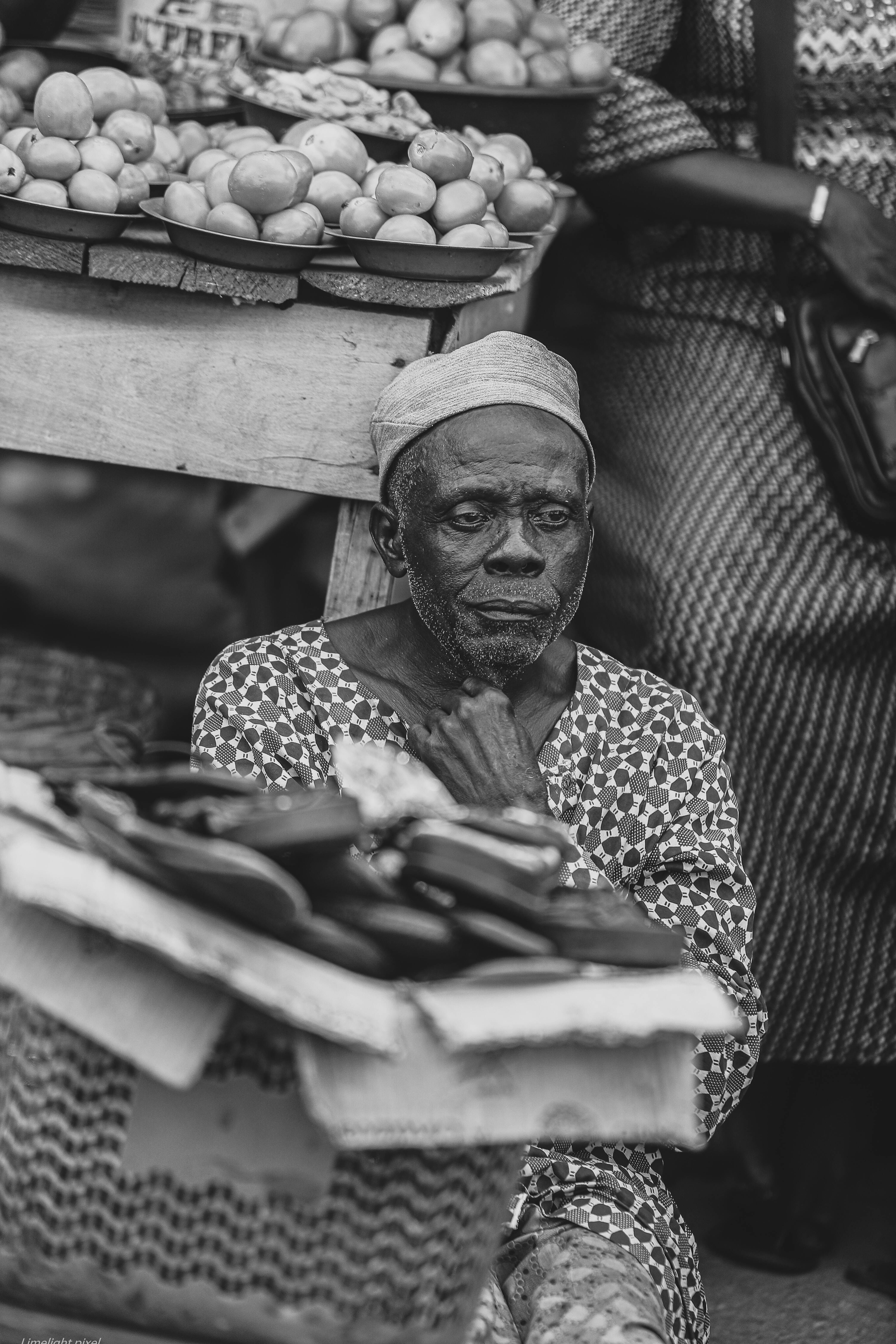 Black and White Portrait of Market Vendor · Free Stock Photo