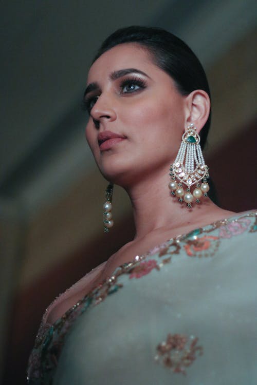 Woman Wearing Silver-Colored White Pearl Chandelier Earrings