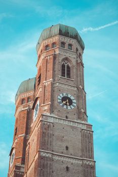 Stunning view of the Frauenkirche towers with blue sky in Munich, Germany.