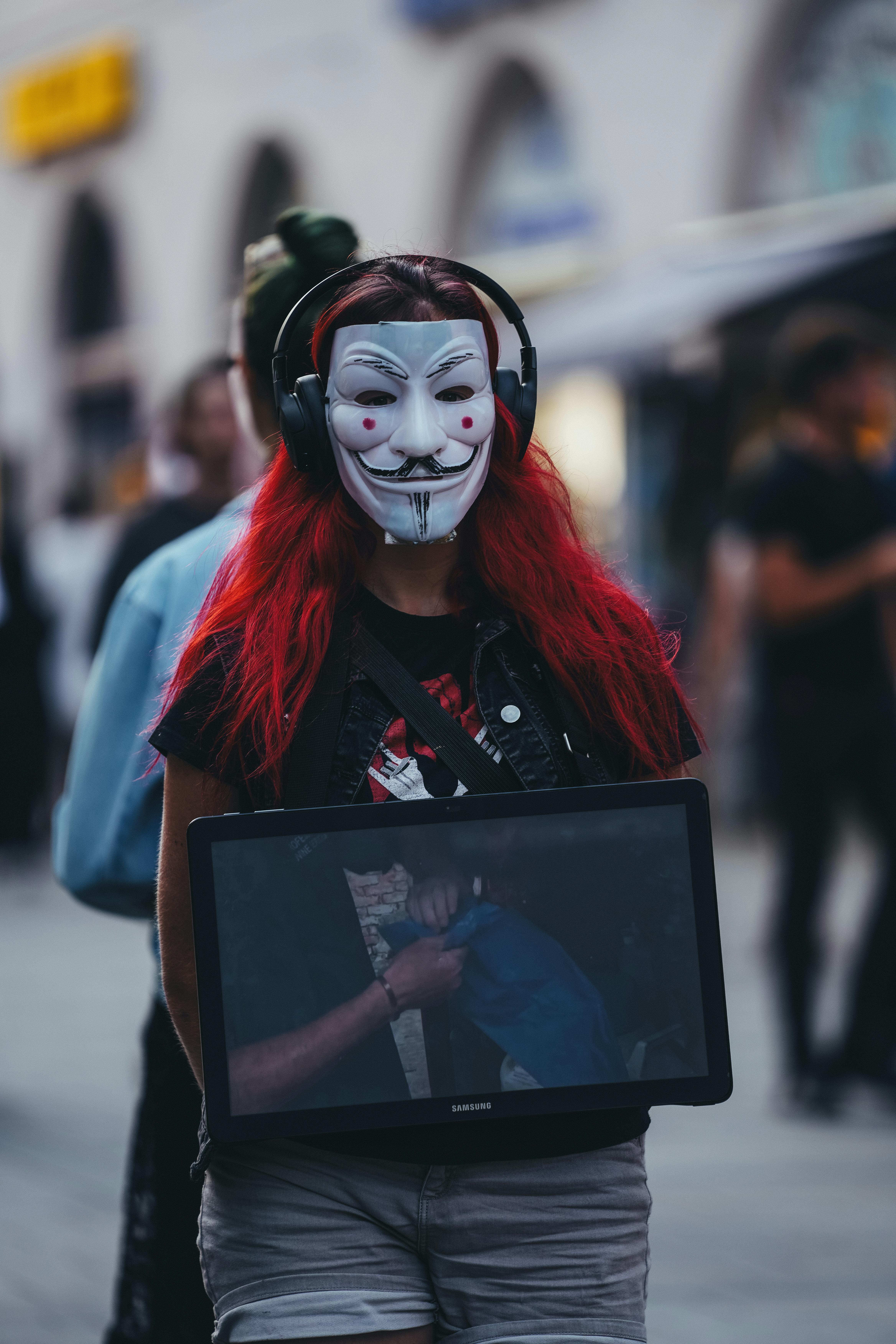 anonymous protester with guy fawkes mask in munich