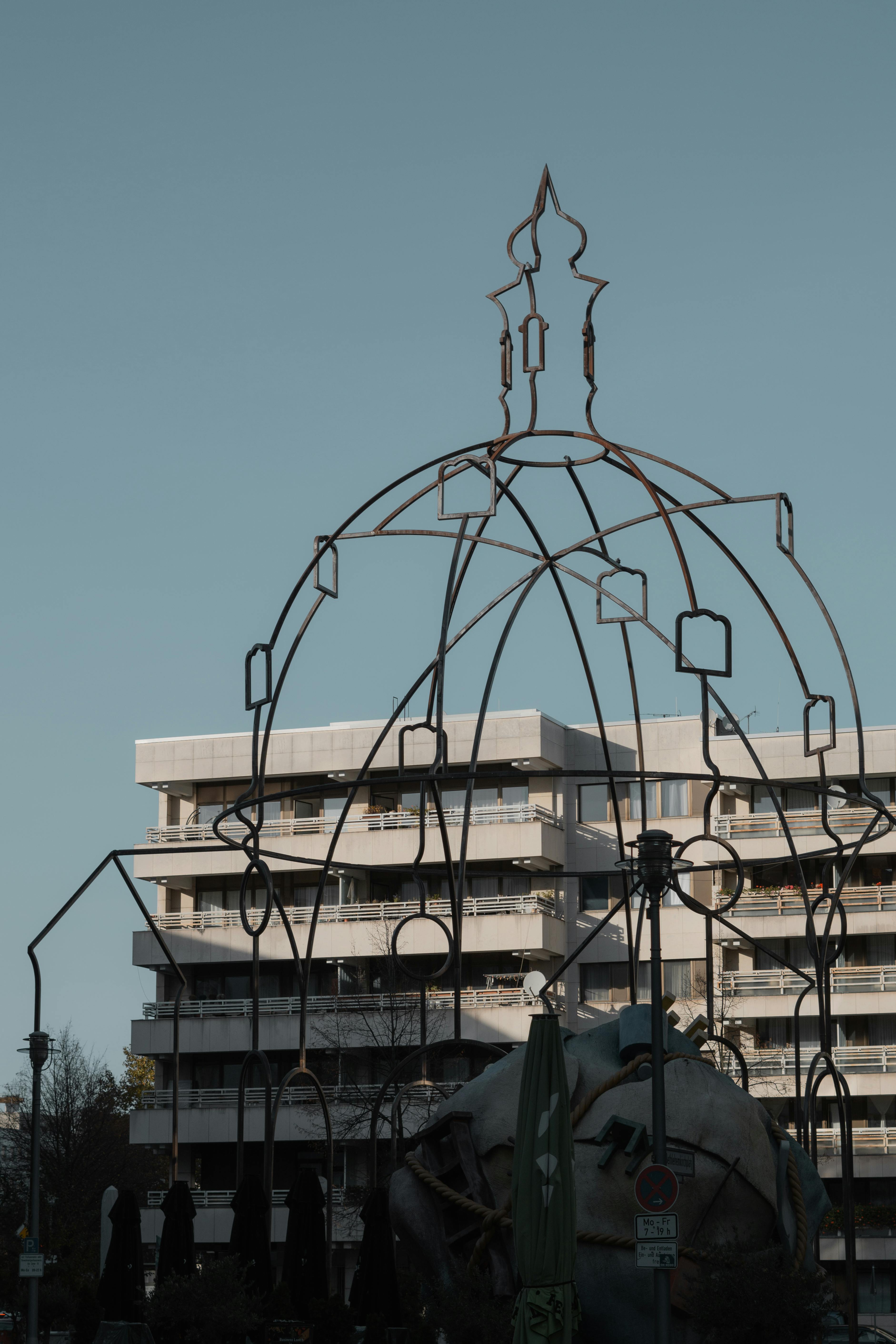 artistic metal structure against urban backdrop in berlin