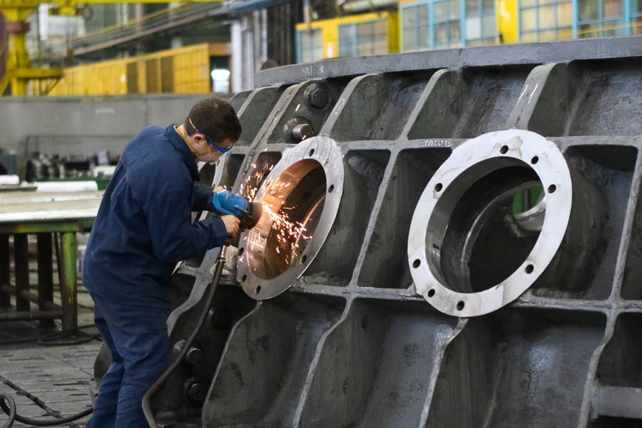 Worker welding metal