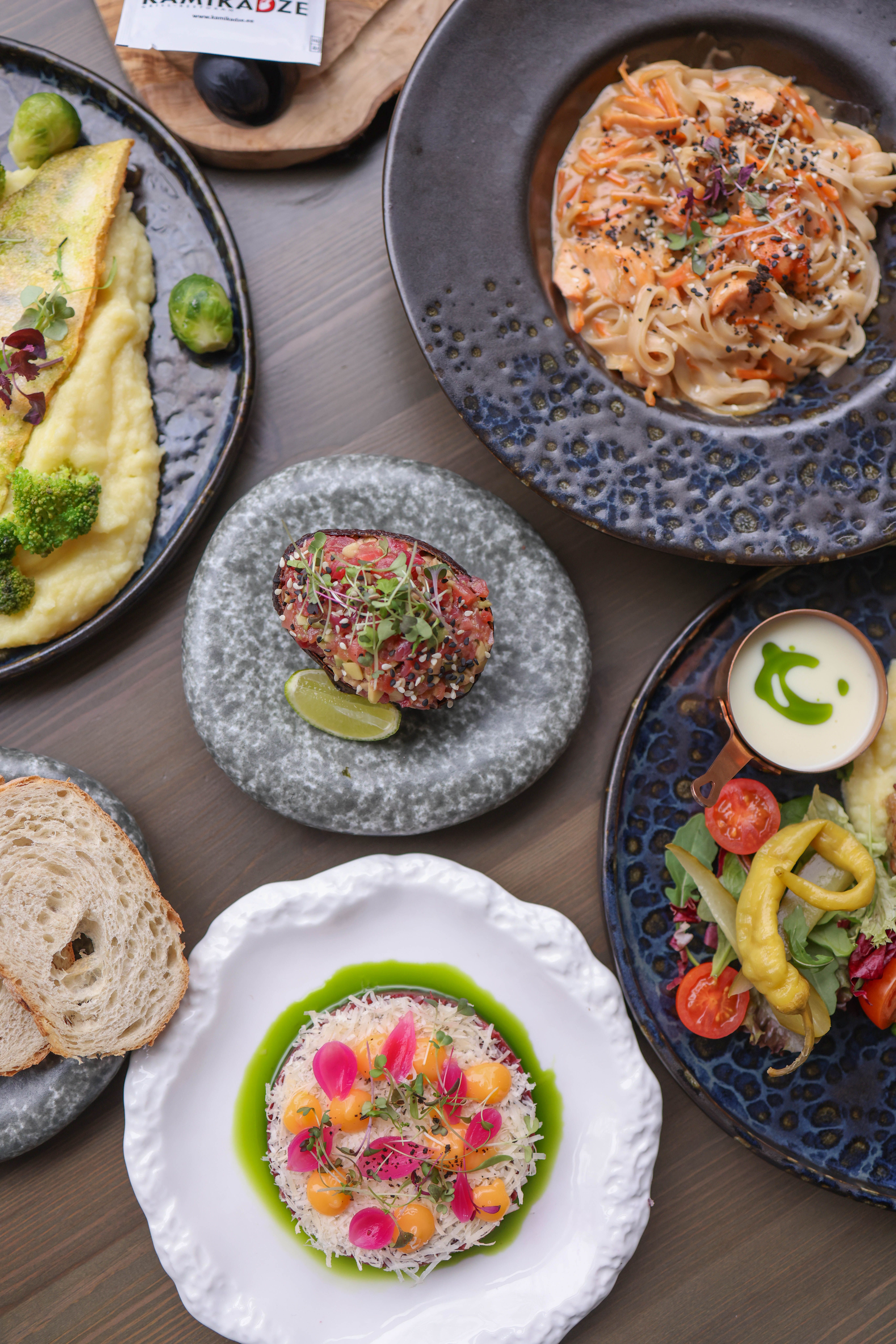 Image showcasing Gourmet Dining Experience with Diverse Cuisine · Free Stock Photo