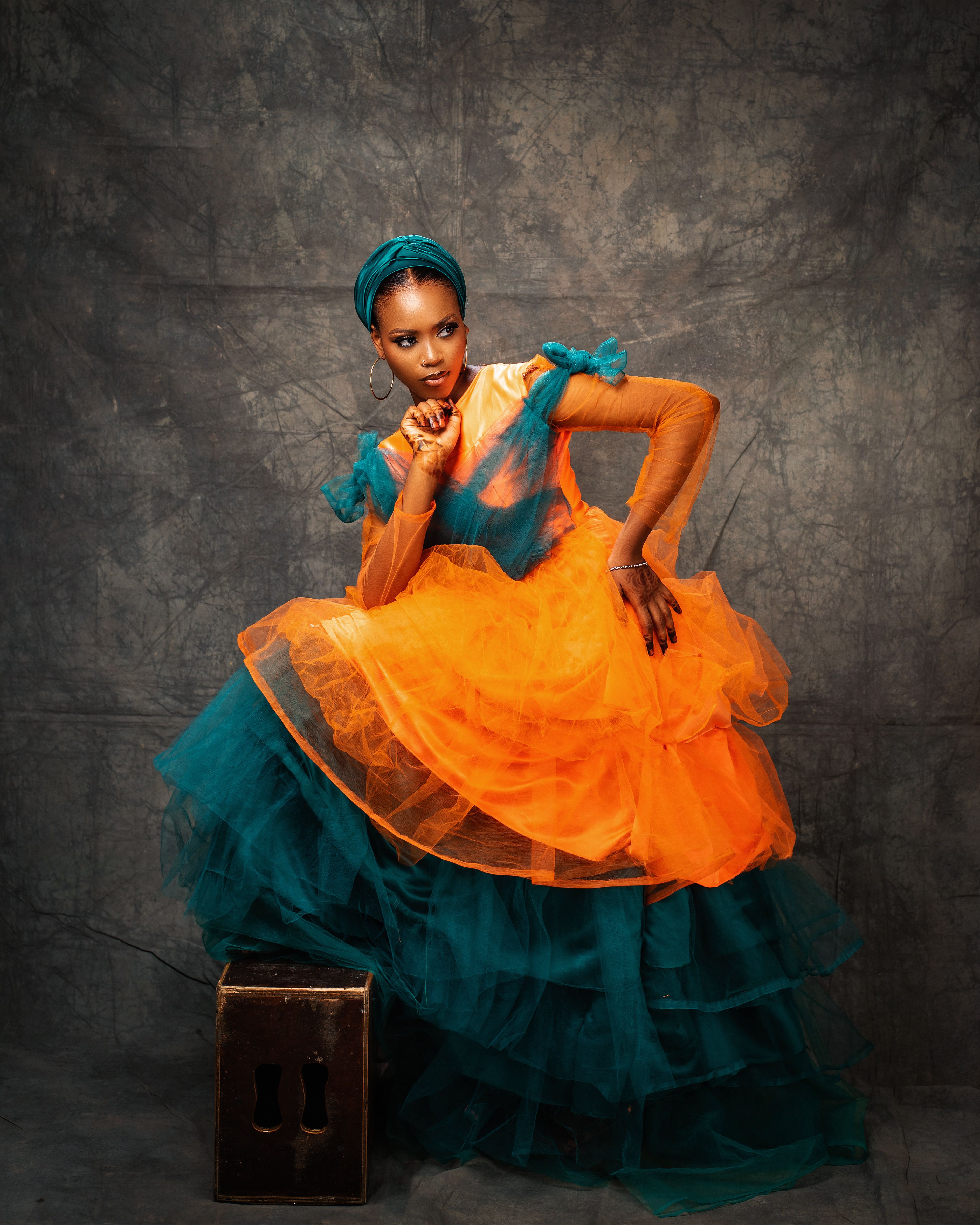 Dramatic Portrait of a Woman in Vibrant Fashion · Free Stock Photo