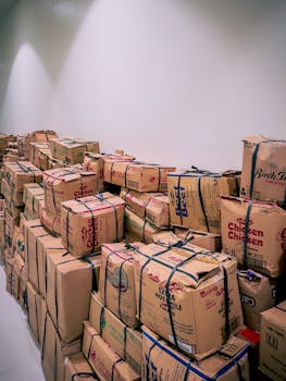 Large stack of cardboard boxes in a warehouse setting in Central Visayas, Philippines.