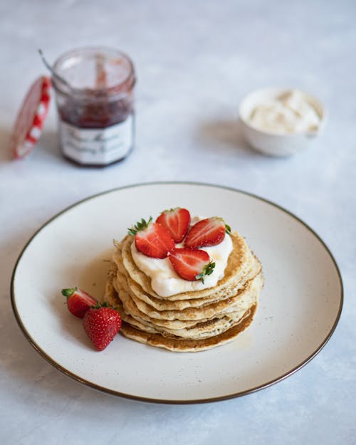 Free Pancakes With Sliced Strawberries On Top  Stock Photo