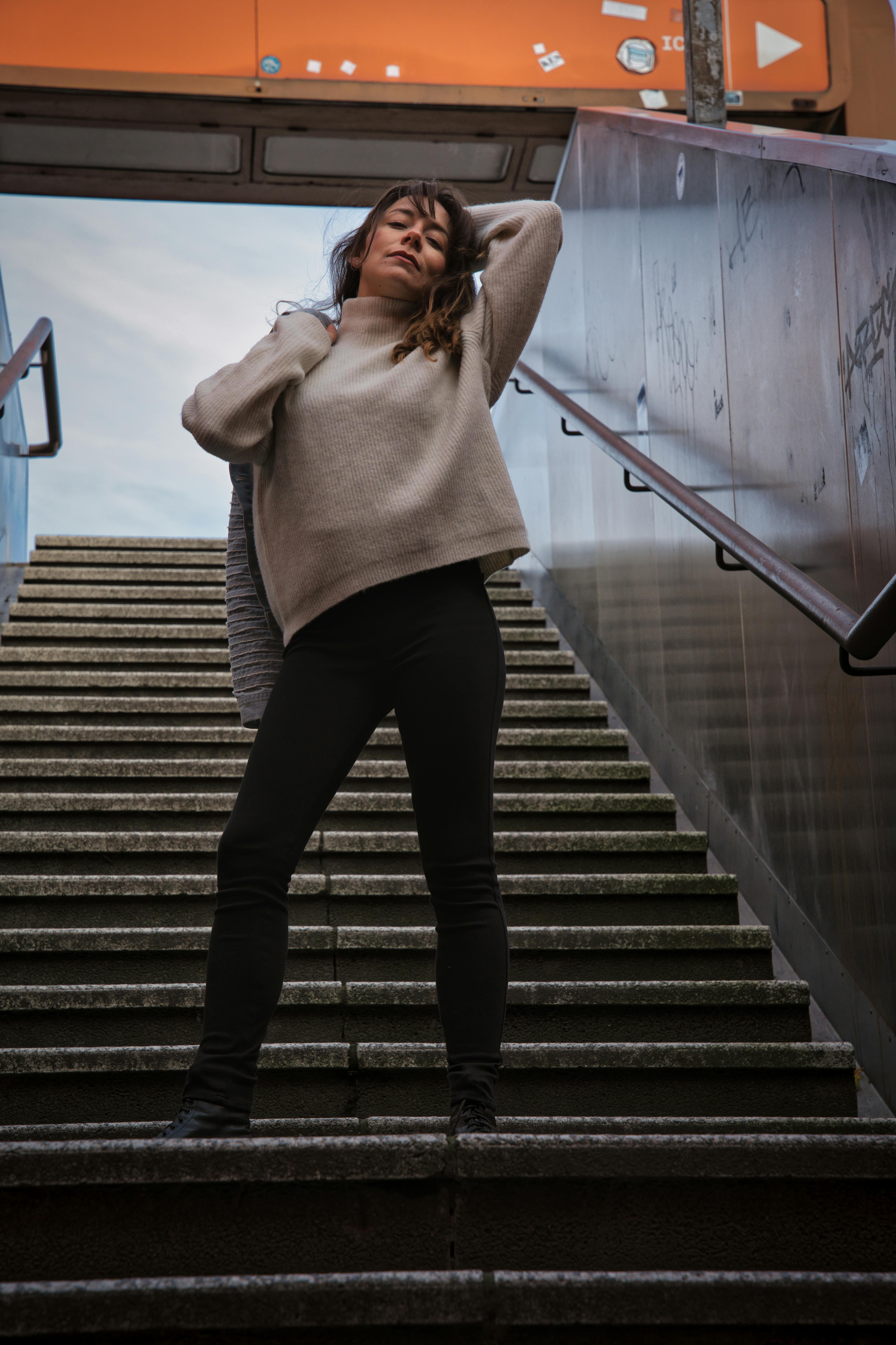 stylish woman posing on berlin staircase