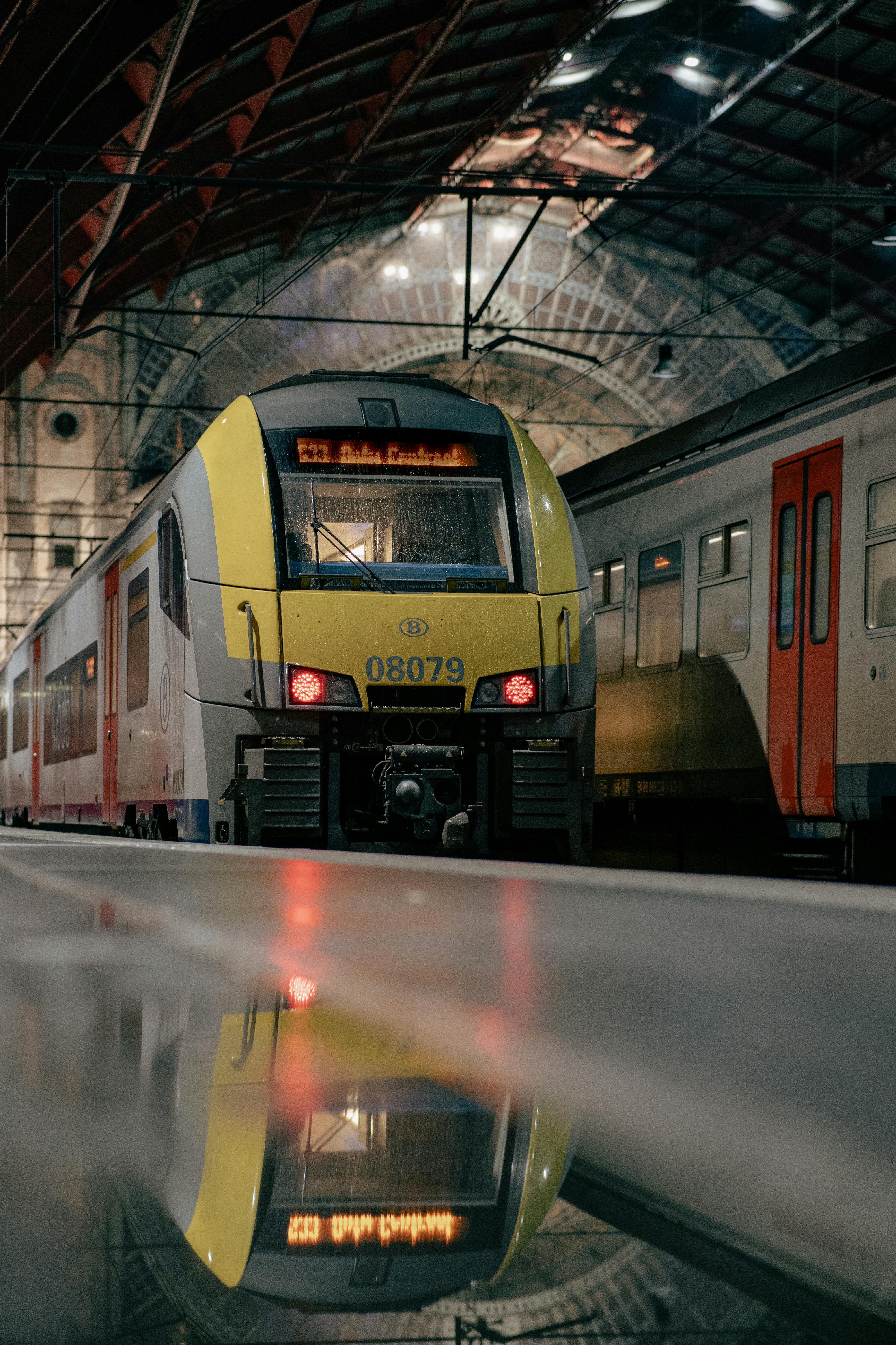 train inside antwerpen central station with reflection