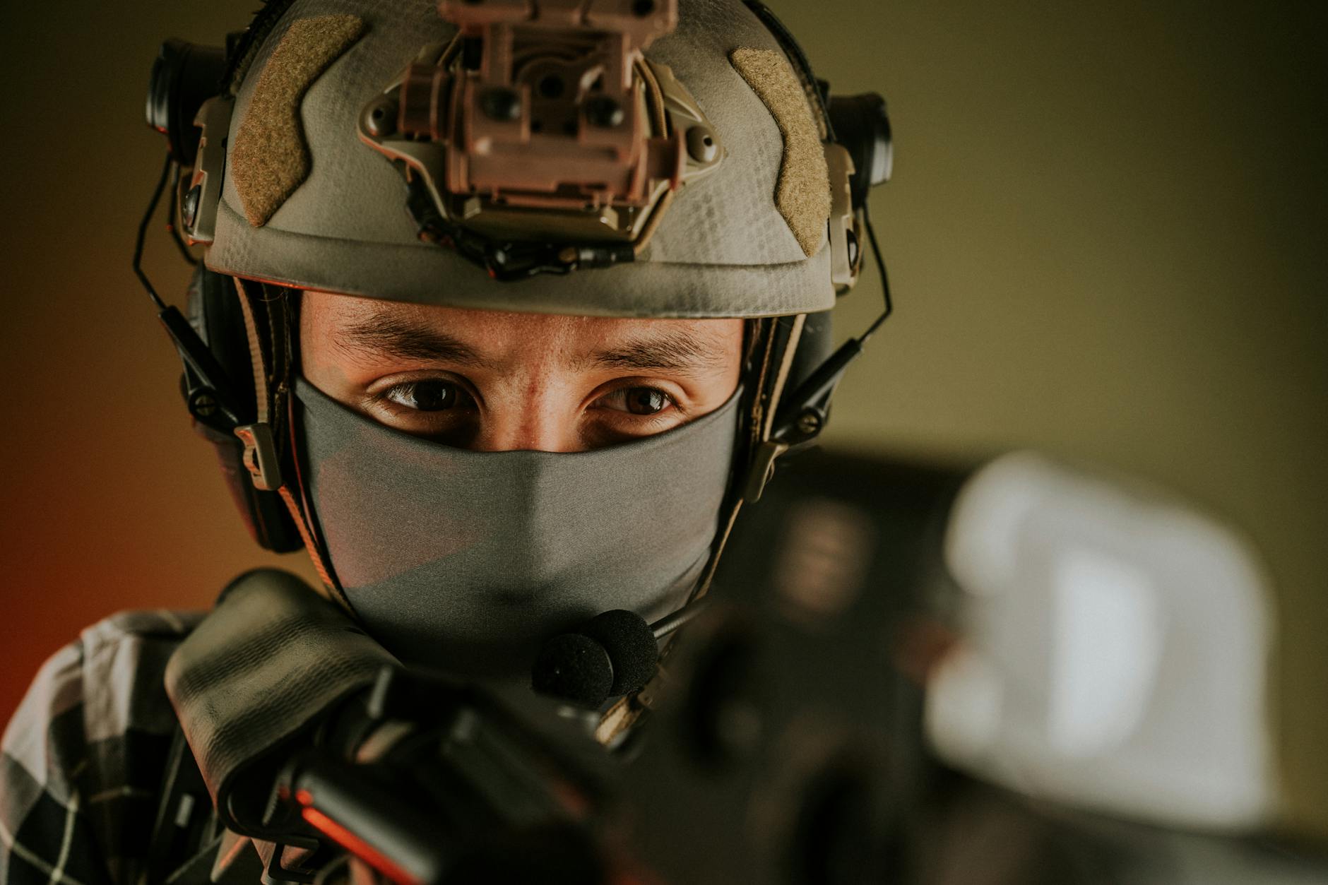 Close-up of a masked soldier in tactical gear