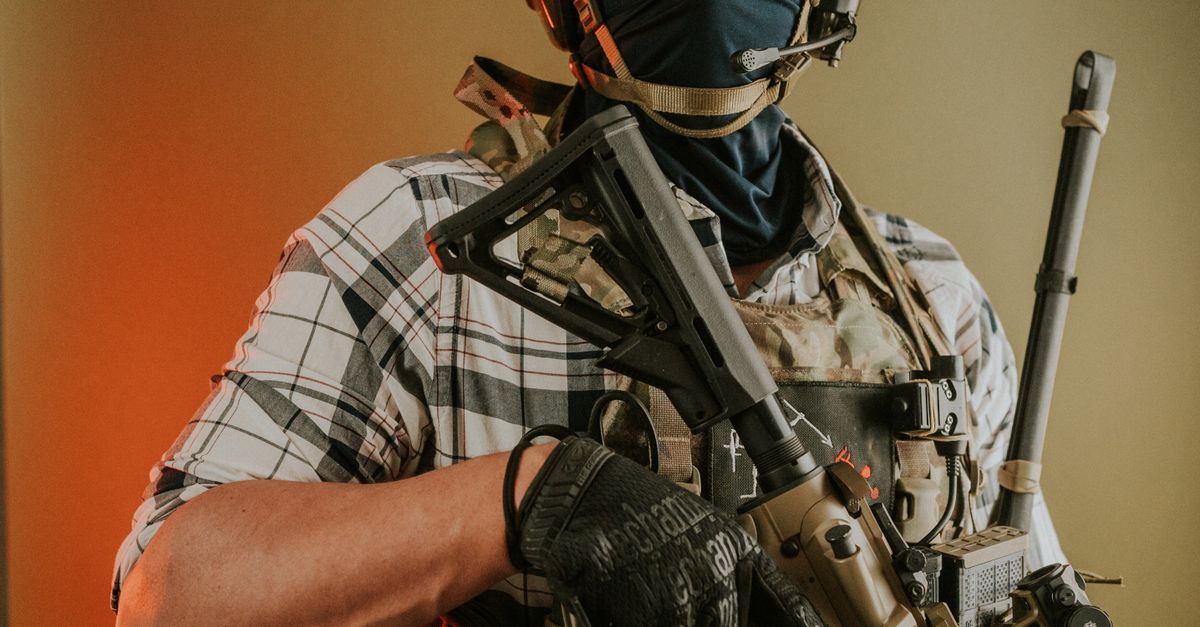 Tactical Rifle Crop Tactical Soldier in Combat Gear Holding Rifle · Free Stock Photo