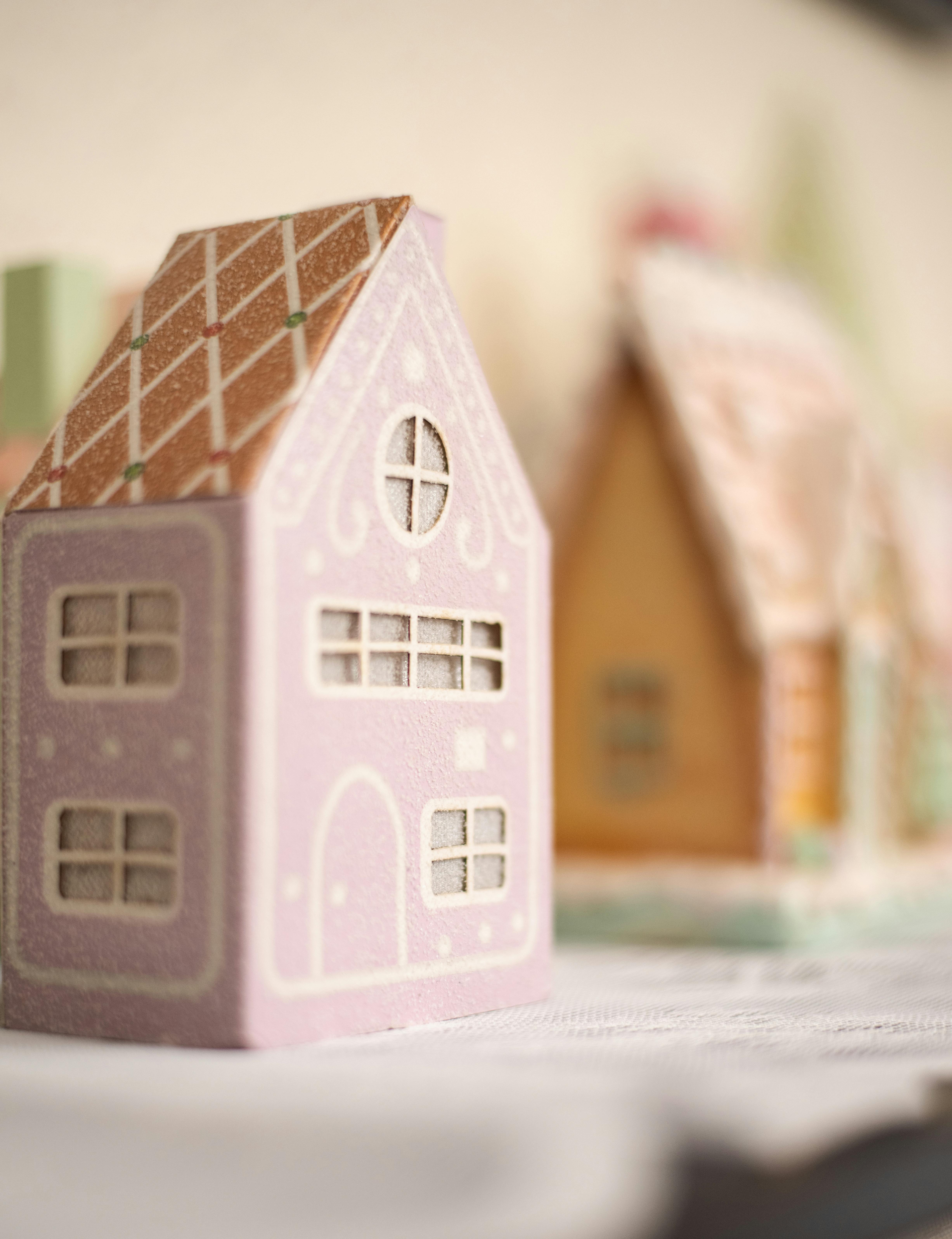 A cozy scene of pastel gingerbread houses, perfect for festive decoration and holiday spirit.