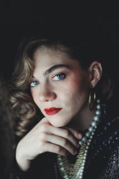 Close-up portrait of a woman with vintage jewelry, exuding elegance and sophistication.