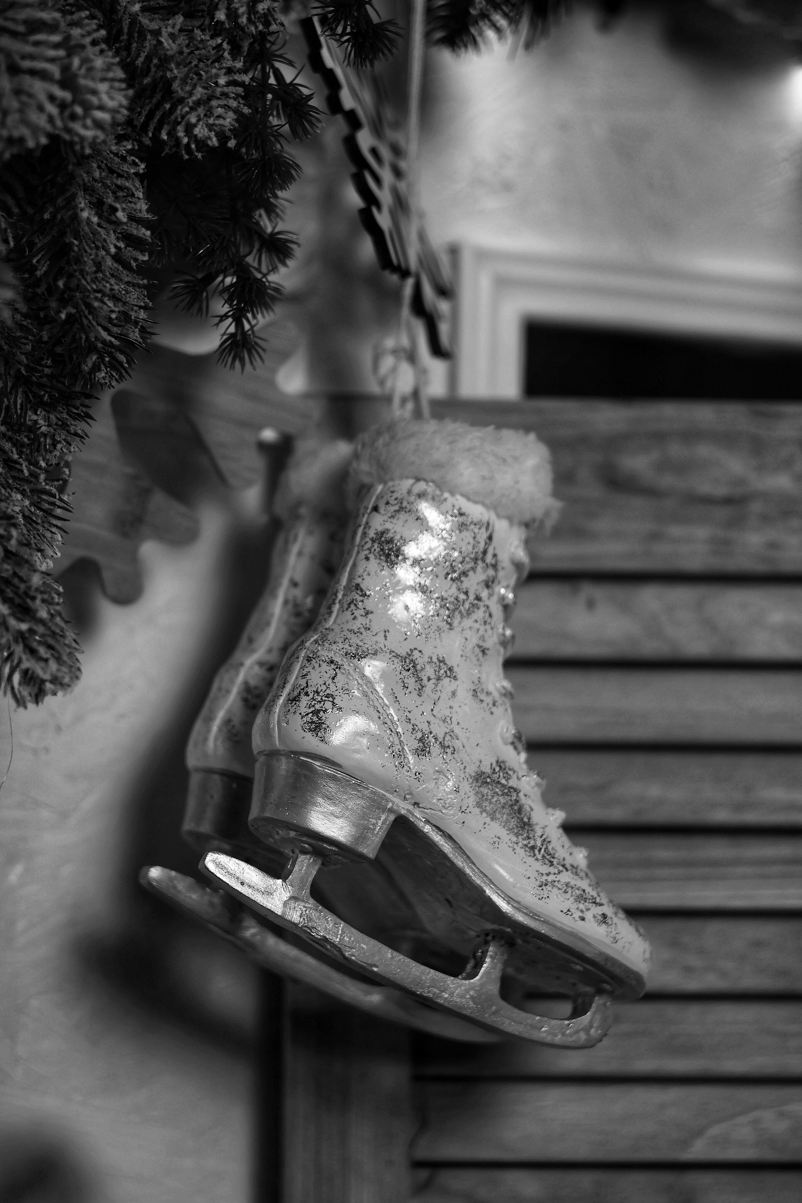 Black and White Winter Ice Skates Hanging Indoors · Free Stock Photo