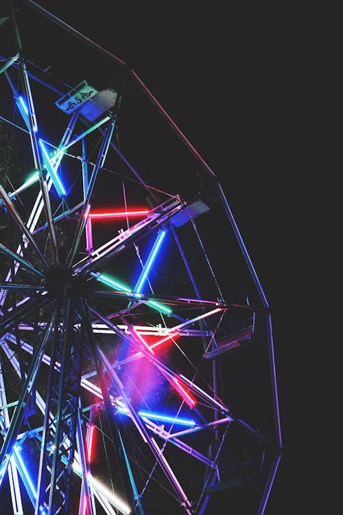 Close-up of a Ferris Wheel with Neon Lights