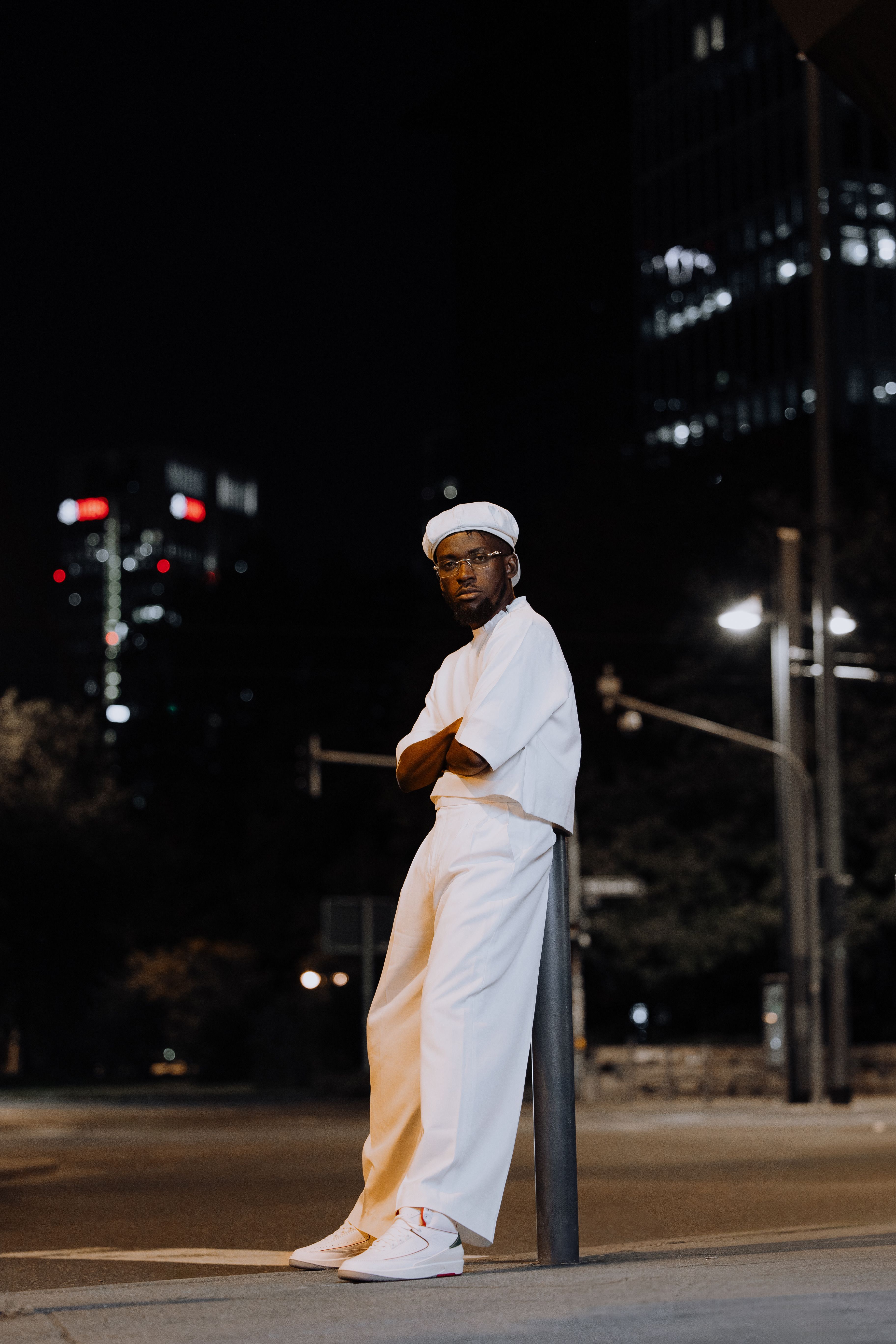 Stylish Young Man Posing in Urban Night Setting · Free Stock Photo