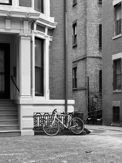 Free Monochrome urban scene featuring bicycles against classic architecture. Stock Photo