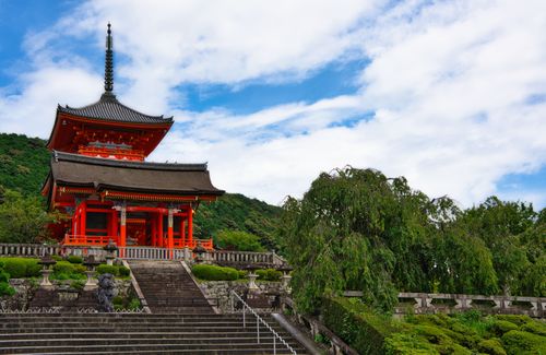 Free Beautiful view of Kiyomizu-dera Temple surrounded by lush greenery in Kyoto, Japan. Stock Photo