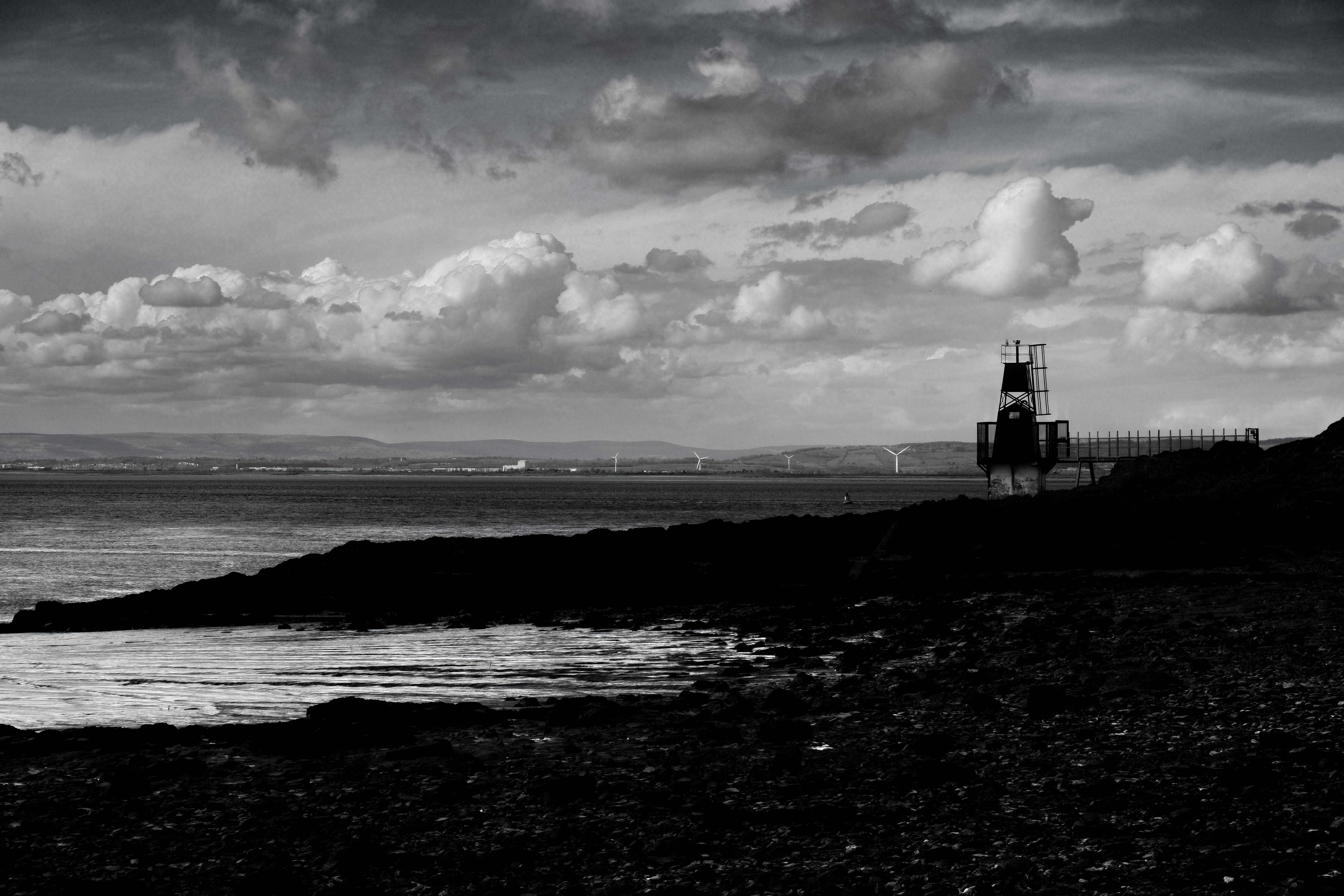 Dramatic Black and White Coastal Scene with Lighthouse · Free Stock Photo