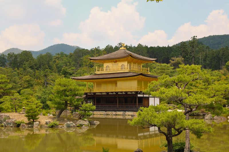 Kinkaku-ji reflected in its Kyoto garden pond — photograph by Bruna Santos on Pexels