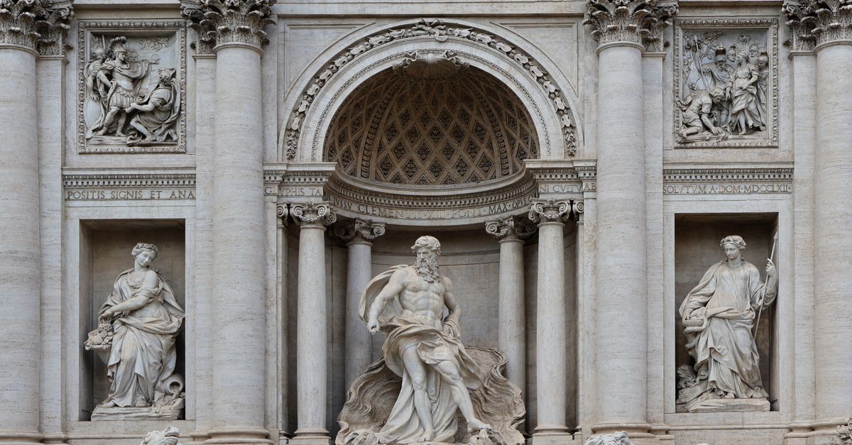 Close-up of Trevi Fountain statues showcasing classic Roman architecture and sculptures.