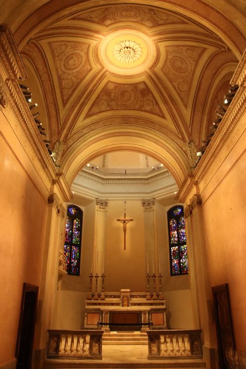 Free Beautiful interior view of a church in Milano, showcasing stained glass windows and arches. Stock Photo