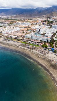 A stunning aerial view of Tenerife's beach and resort area in the Canary Islands.
