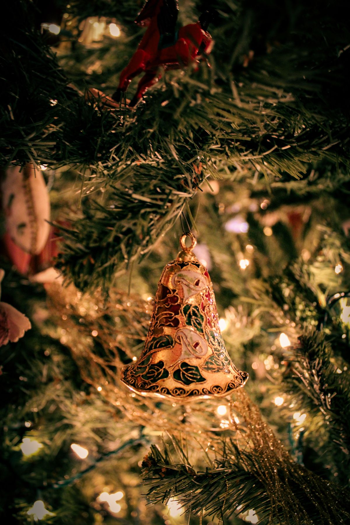 Christmas ornament ideas with a festive Christmas tree with an ornament bell