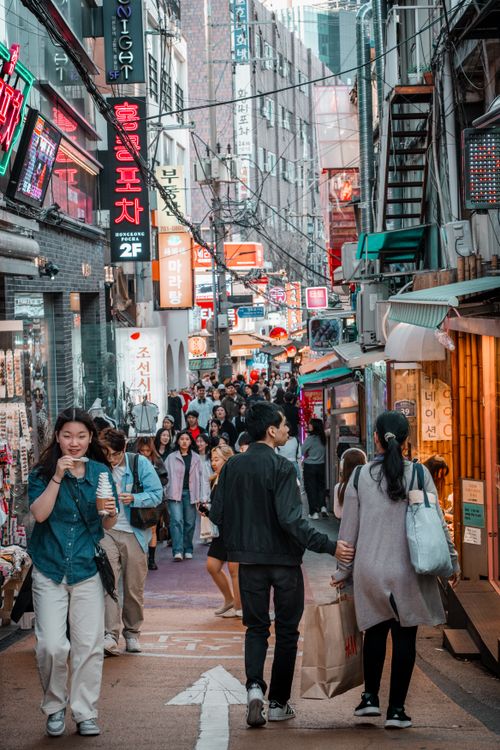 Free Lively street in Seoul with bustling crowds, colorful signage, and urban atmosphere, showcasing local culture. Stock Photo